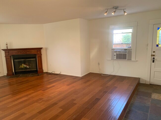 Living room w fireplace & AC unit - 3728 E 5th St