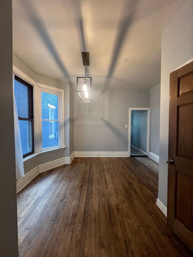 Building Photo - Renovated and Charming Townhome Available Now