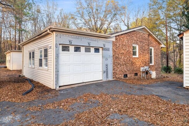 Building Photo - McLeansville - Minutes from Elon & Greensboro! Few Acres, Brick Duplex, Just Painted, New Carpet,...