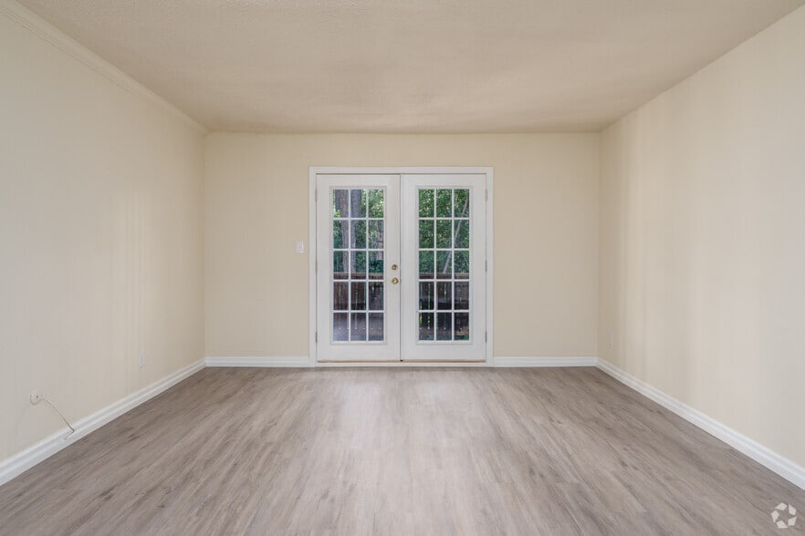 2BR, 1BA - 1,000SF - Living Room - Royal Springs Apartments