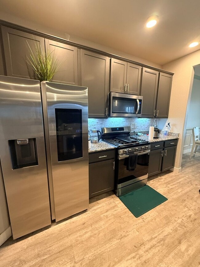 Building Photo - Like-New 4BR Home with EV Charging & Designer Upgrades