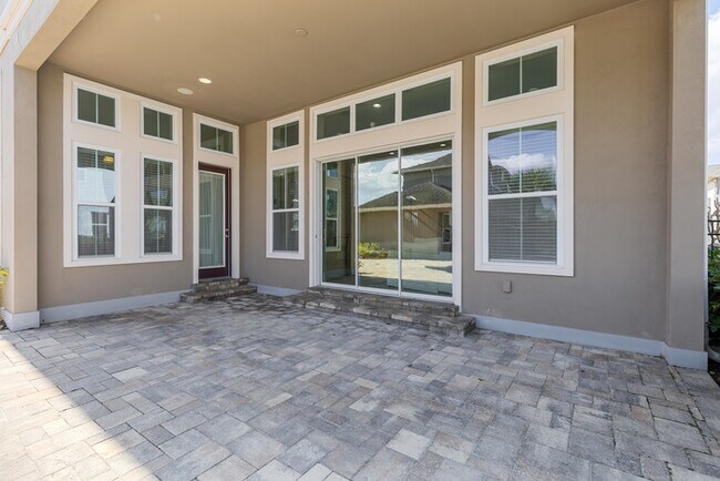 Building Photo - Luxury Waterfront Pool Home in Laureate Park | 4BR + Water Views