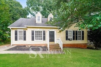 Building Photo - Feel welcome in this well-maintained 4BR 2...