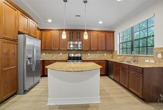 Building Photo - 13011 Riverwalk Cir N