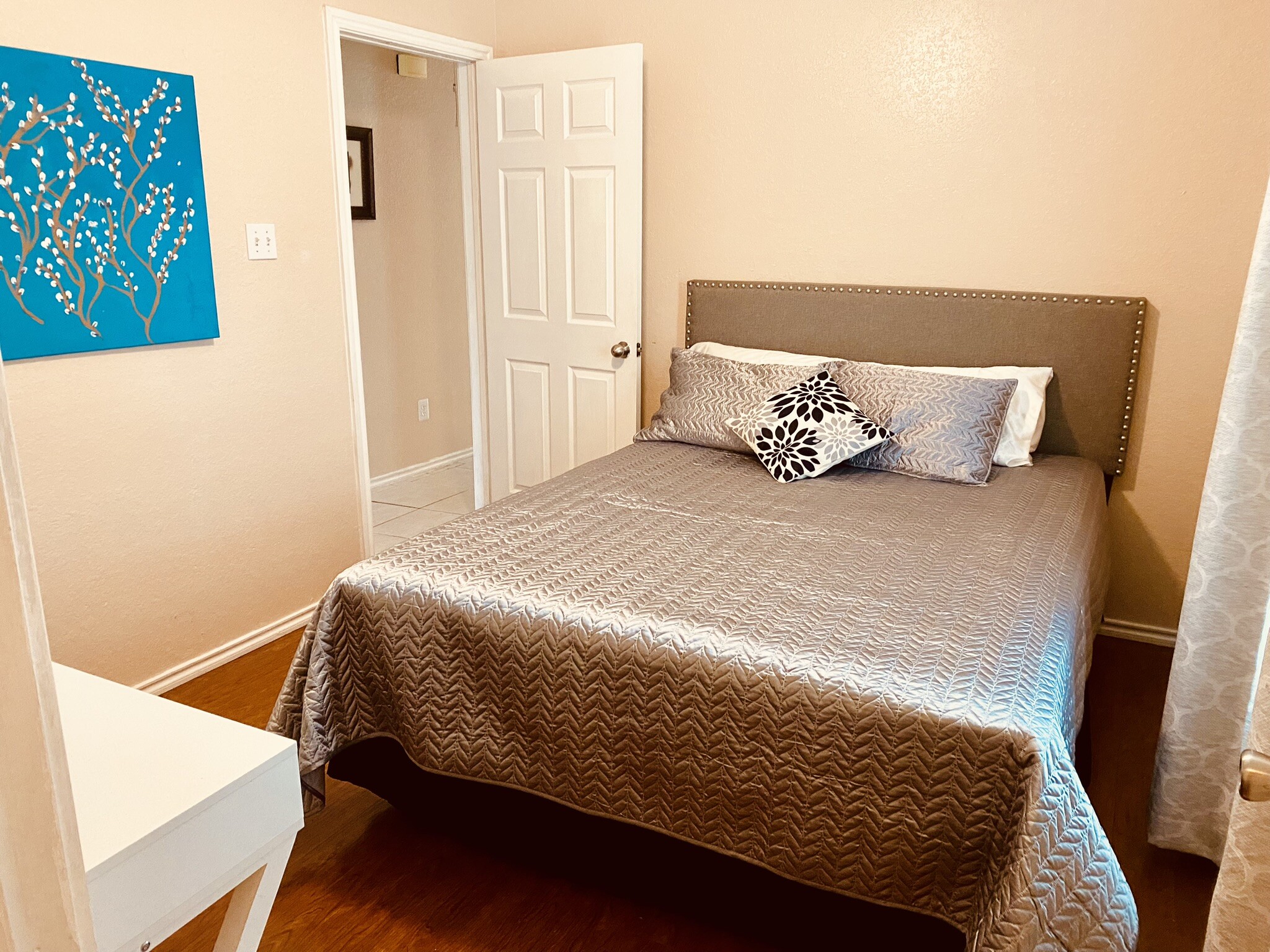 Bedroom 2 large enough for a queen bed and a desk. - 6748 Trail Lake Dr