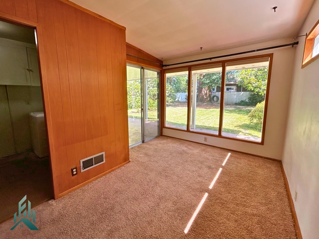 Building Photo - Charming 4 Bedroom Home with Hardwood Floors, Gas Fireplace & Large Fenced Yard