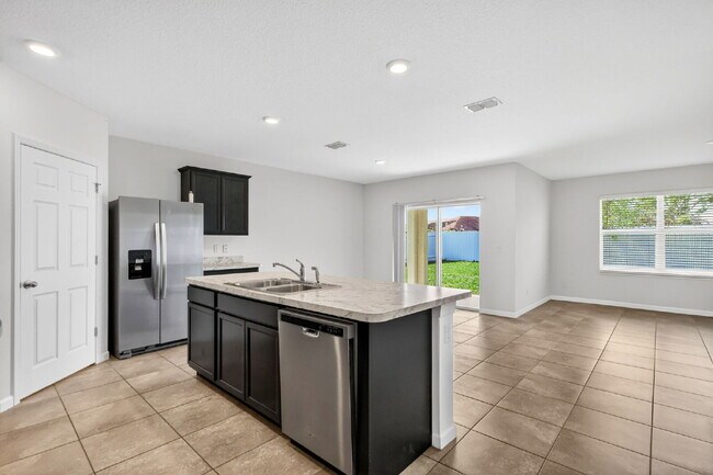 Building Photo - Renovated 4 Beds 2 Baths Single Family on Over a QTR Acre lot | Huge Yard