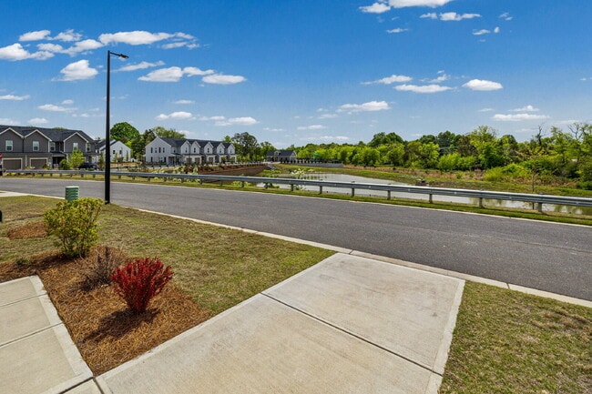 Building Photo - Spacious 3BR Townhome with Garage, Open Layout & Community Pool – Move-In Ready!