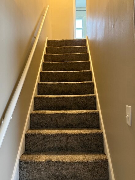 stairwell to bedrooms - 114 W Spring St