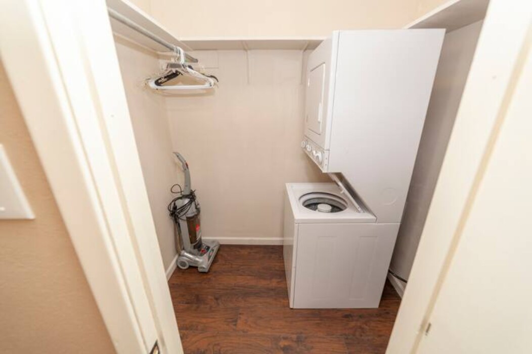 Masterbedroom closet with washer, dryer and vacuum - 303 Babcock Rd