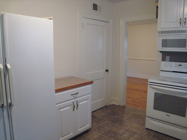 Kitchen to dining room view. - 1911 E 4th St