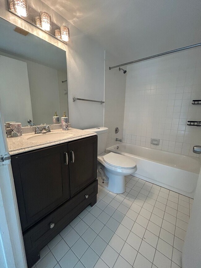 Building Photo - Now Leasing: 1-bedroom and 1.5 bath condo ...