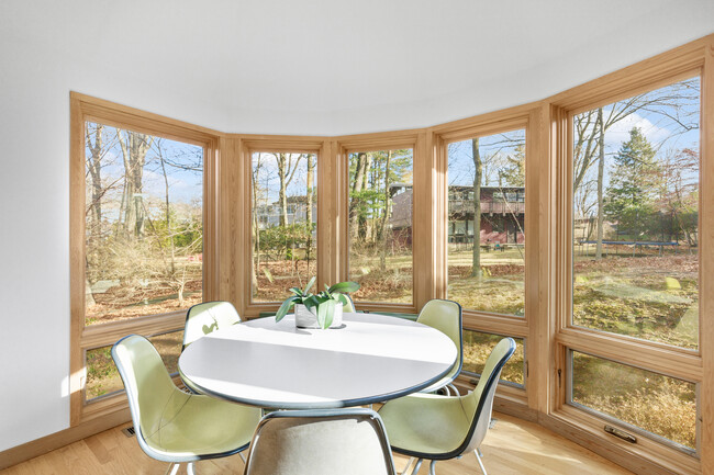 Breakfast room featuring windows with a view of the backyard. - 19 Cottontail Ln