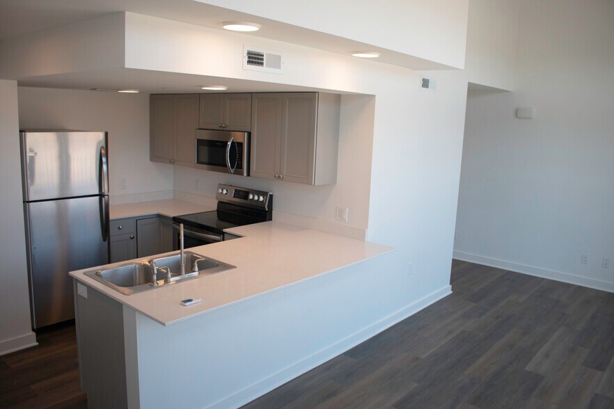 Kitchen with stainless appliances - 318 E 6th St