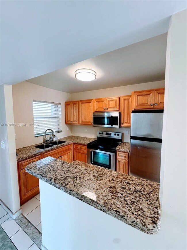 Building Photo - 8595 Sunrise Lakes Blvd