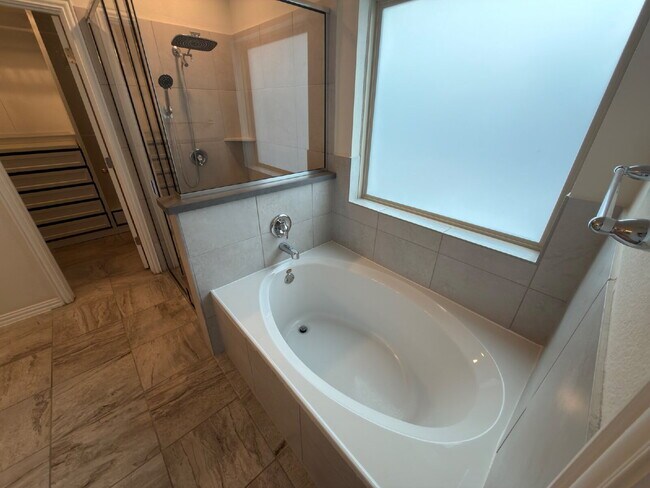 Building Photo - Four bed two bath on a corner lot with a pool in Sunfield. Gas cook top, double ovens. Open kitch...