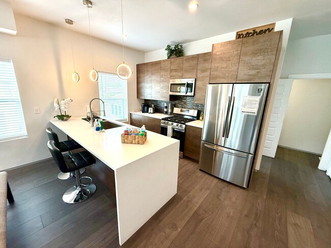 Building Photo - AVAILABLE NOW! Jaw Dropping 3 Story 3 Bedr...