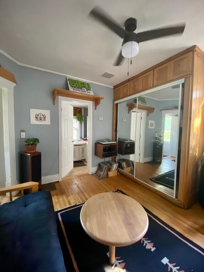 Main living room w/ doorway to the bathroom - 1301 E 7th St