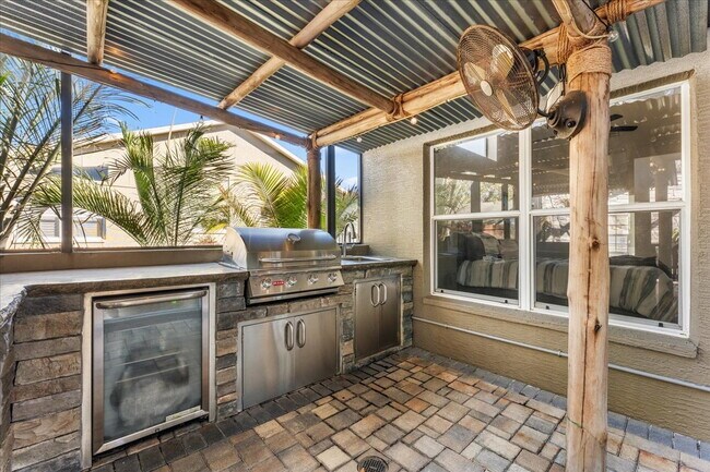 Building Photo - A vibrant 2-bedroom, 2-bathroom tropical retreat designed for both high-energy entertaining and l...