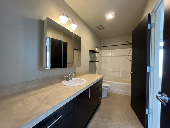 Building Photo - Charming 3 Bedroom, 2.5 Bathroom Home with Large Living Room, Tall Windows, Island Kitchen, and A...