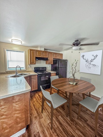 Prepare meals with ease in kitchens equipped with contemporary appliances, ample cabinetry, and functional layouts. - Woods Crossing Apartments