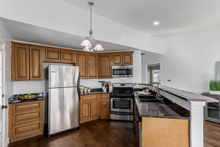Granite countertops and SS appliances - 1451 S Quitman St