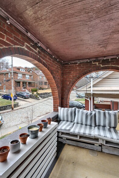 Enjoy your own private covered porch. Perfect for morning coffee or unwinding after work. - 203 Richbarn