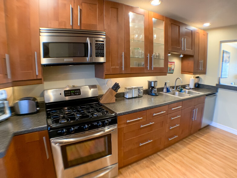 Fully updated with dishwasher, garbage disposal, microwave, gas stove, and under-cabinet lighting. - 2425 Ashdale Dr