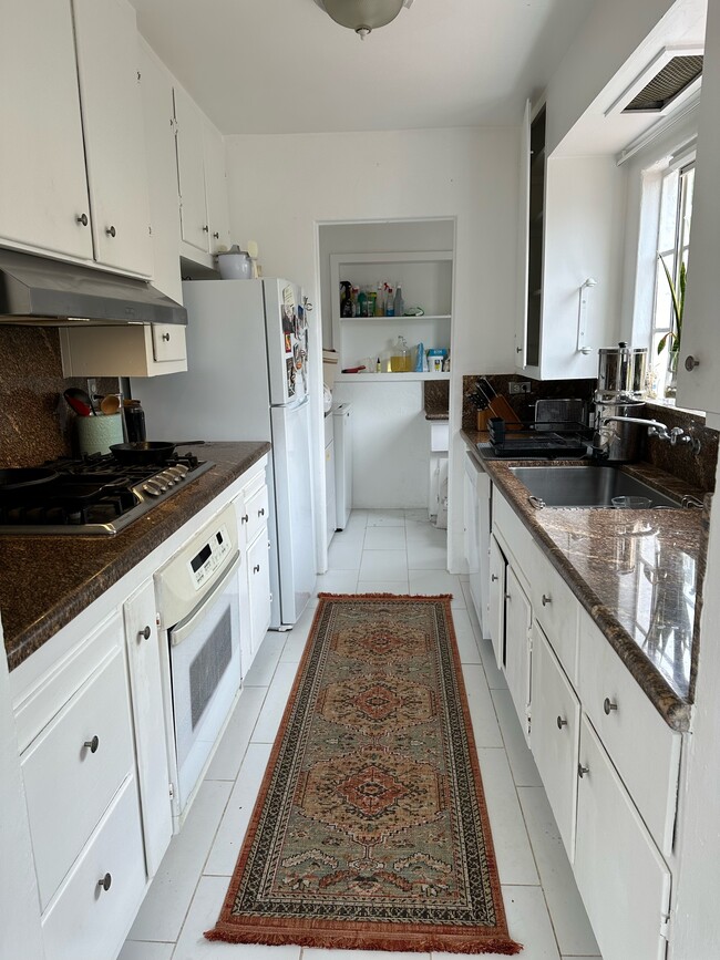 Kitchen and laundry room behind it - 4231 Chase Ave