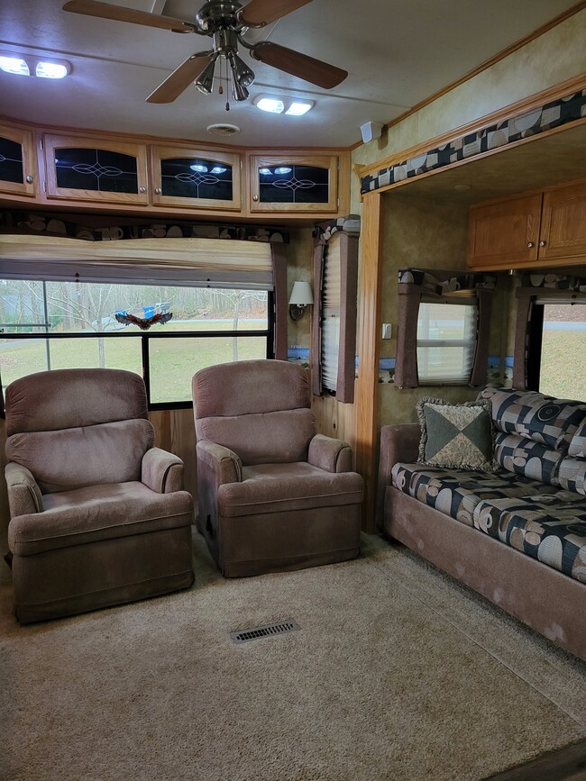 Living room with couch and two glider rockers.. - 106 Mountain Shore Dr