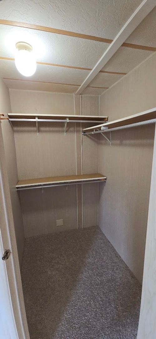 Building Photo - 2 bed 2 baths with carport