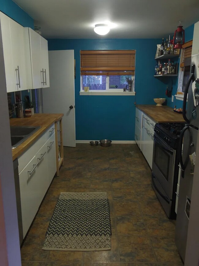 upstairs kitchen- walls now white - 4038 Kalamath St
