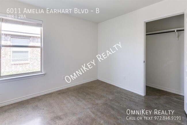 Building Photo - 6011 Amelia Earhart Blvd