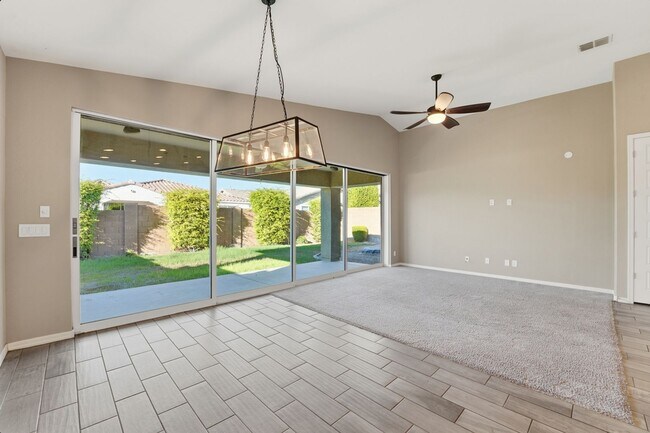 Building Photo - Stunning 4-Bed + Den Eastmark Home with Modern Upgrades Throughout