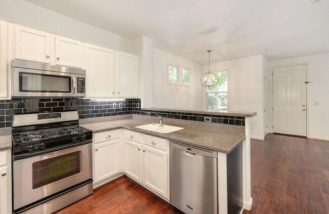 Building Photo - Experience Esplanade! Premier Townhome Com...