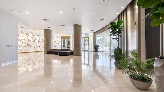 Building Photo - 10275 Collins Ave