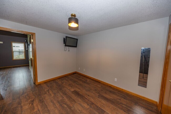 Building Photo - One Level Home - Three Bedroom + Bonus with AC / Beautiful Yard!