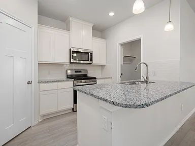 Building Photo - 3 Bedroom 2 bath, 2 garage attached garage with all the appliances to include washer & dryer