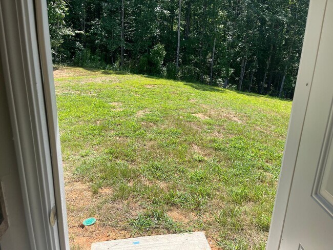 Building Photo - Available Now – Spacious 4BR Home on 1.5 Acres in Rural Hall!