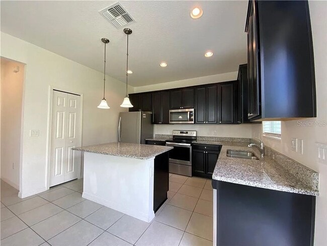 Building Photo - Beautiful End Unit Townhome Near Lake Nona w/ 2-Car Garage & Conservation Views!