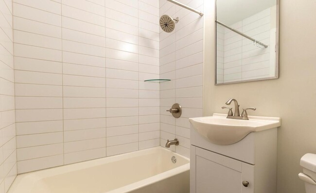 Bathroom with updated vanity and white subway tiles - Sedgwick Terrace