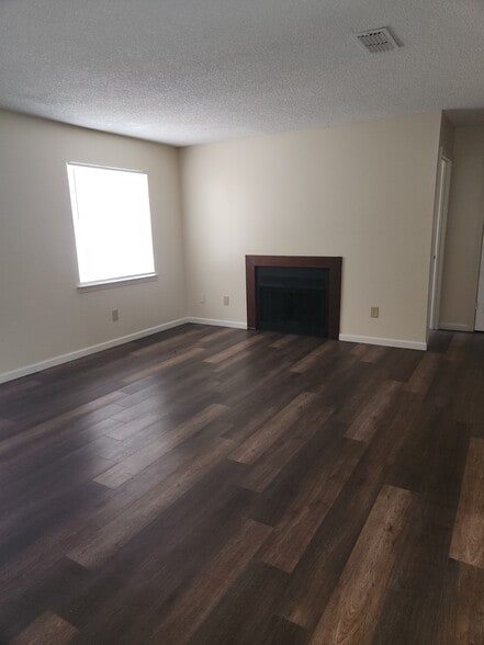 Living room w/Fireplace - 696 S 72nd Ave
