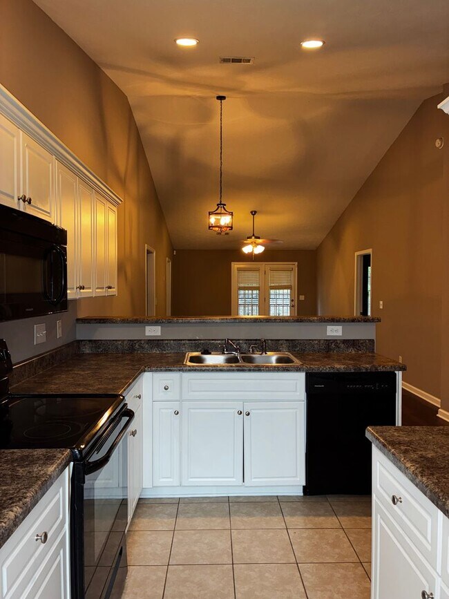 Building Photo - Of course! The marketing title iElegant 3-Bedroom Townhouse with Modern Comforts.