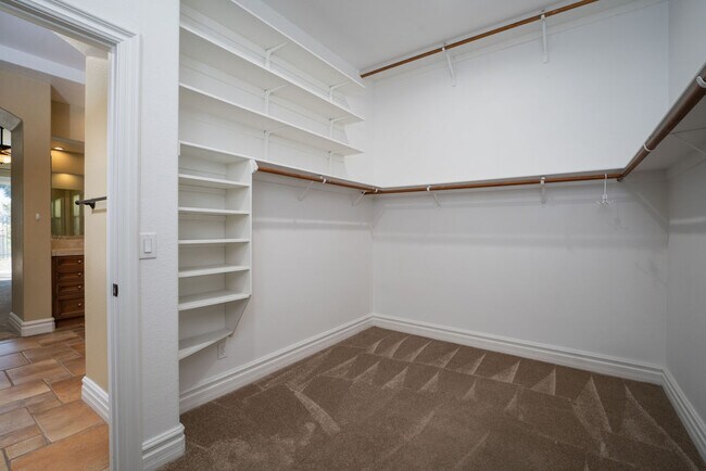 No lack of space in the huge primary walk-in closet just off the bath. - 2850 Bronzino Ct