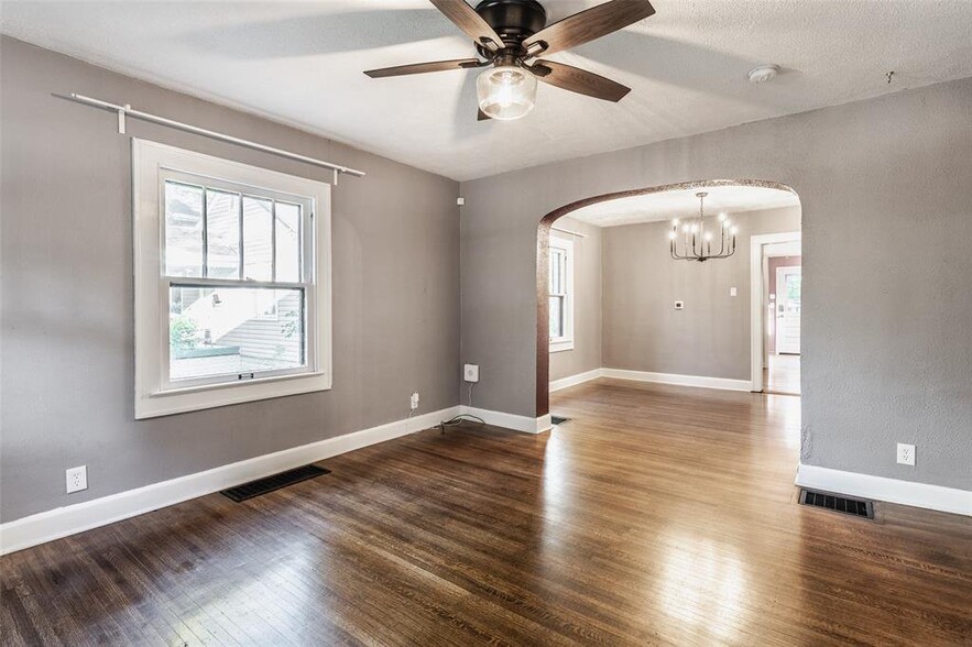 Living room and dining room have large windows for lots of natural light - 5750 Rawles Ave