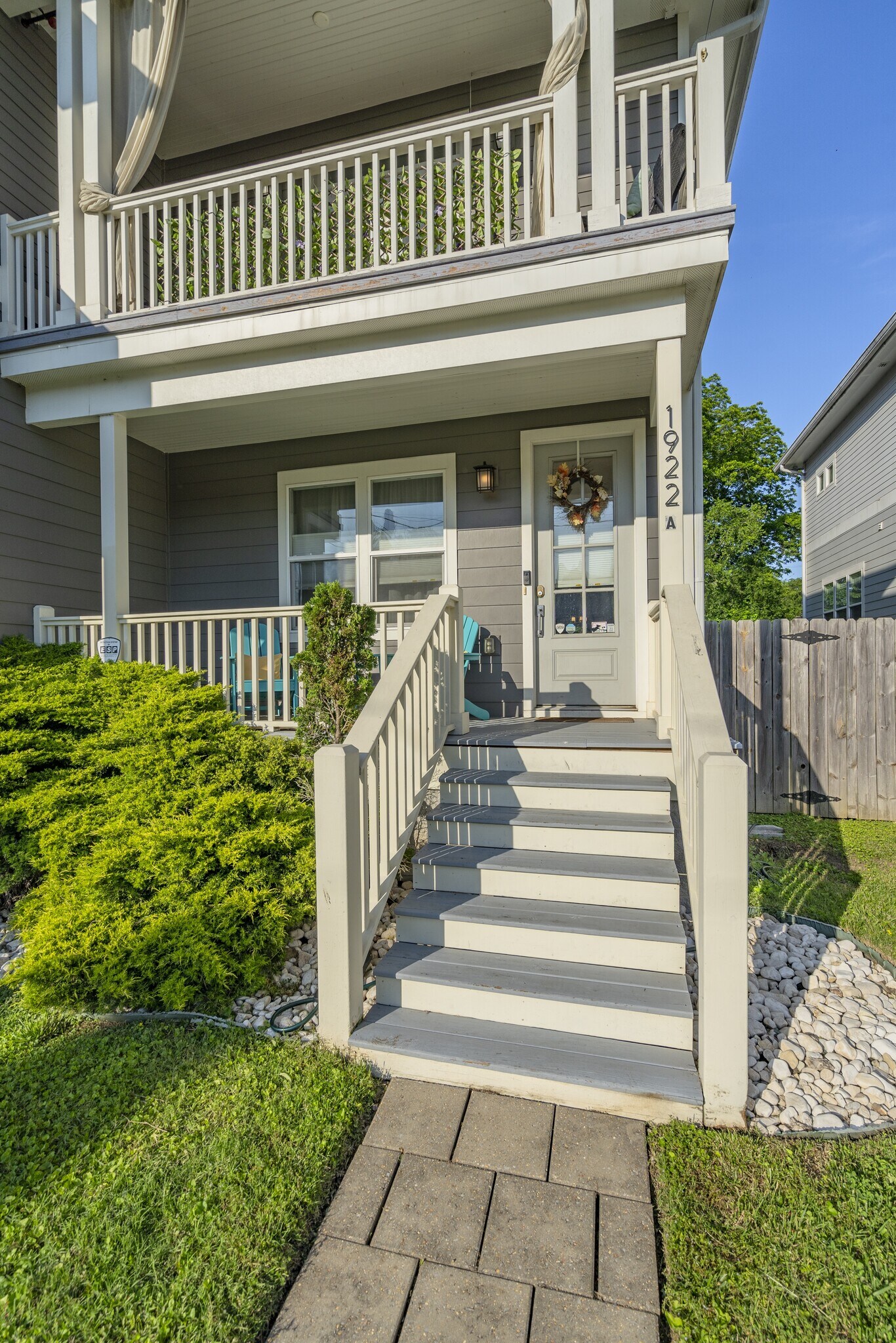 Front entrance with front covered porch with Adirondack Seating - 1922 14th Ave N