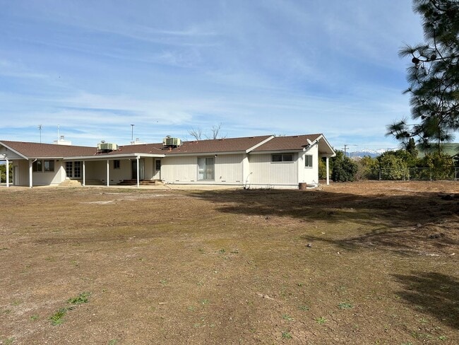 Building Photo - Rare opportunity to experience Country liv...