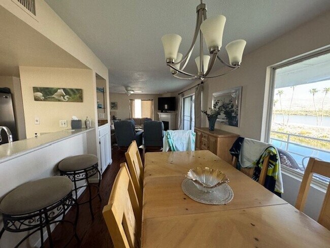 Building Photo - Riverfront 2BR 2BA Furnished Condo on GROUND LEVEL W/Garage and UTILITIES Included AVAIL 4/1/26