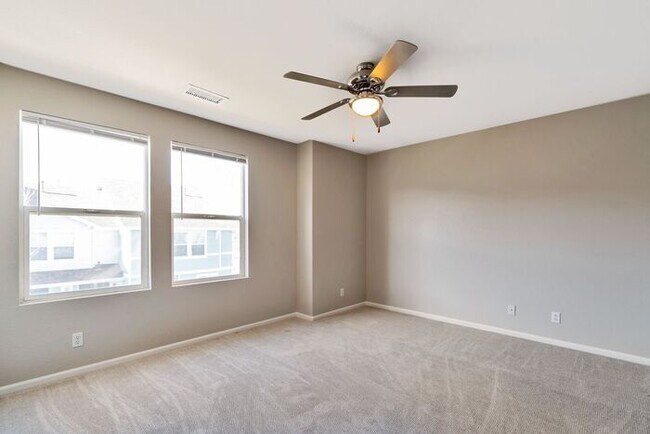 Building Photo - 3BR Townhome Near DIA & Light Rail | New Carpet, Garage & Fenced Patio