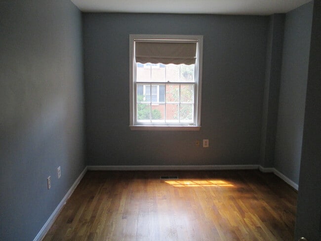 Building Photo - SPACIOUS BRICK TOWN-HOME